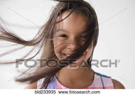 Wind blowing hair of smiling Mixed Race girl View Large Photo Image Stock Photography - Wind blowing hair of smiling Mixed Race girl . Fotosearch