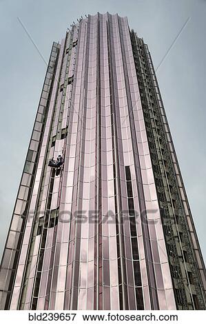 Stock Photo - Window washers on tall building. Fotosearch