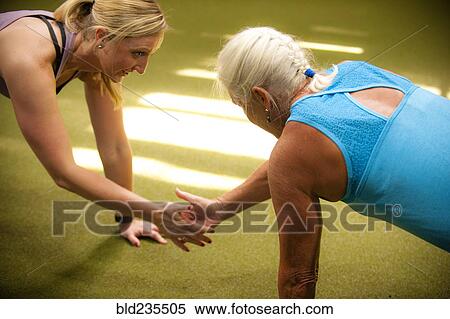 Women doing push-ups clapping hands View Large Photo Image Stock Photography - Women doing push-ups clapping hands. Fotosearch