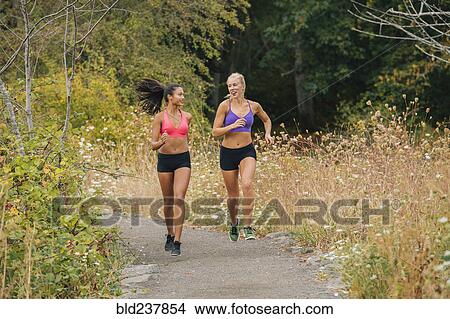 Women sunning on path in park View Large Photo Image Picture - Women sunning on path in park. Fotosearch