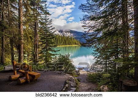 Wooden bench at mountain lake View Large Photo Image Stock Image - Wooden bench at mountain lake. Fotosearch