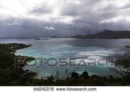 Stock Photo - Aerial view of ocean and lush coastline. Fotosearch