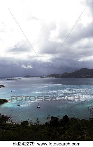 Stock Photo - Aerial view of ocean and lush coastline. Fotosearch
