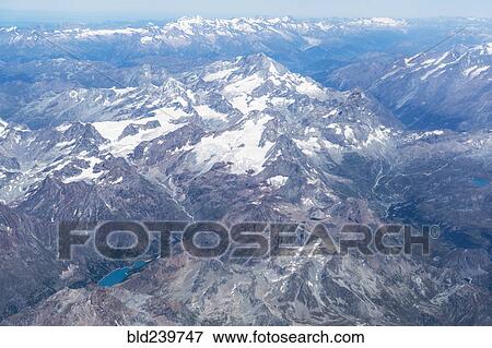 Aerial view of snowy mountain landscape View Large Photo Image Stock Photo - Aerial view of snowy mountain landscape. Fotosearch