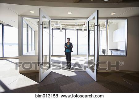 African American businesswoman standing in empty office View Large Photo Image Stock Photo - African American businesswoman standing in empty office. Fotosearch