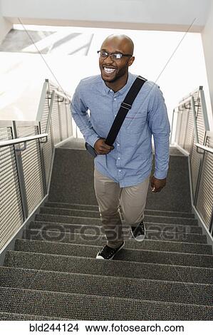 African American man climbing staircase View Large Photo Image Picture - African American man climbing staircase. Fotosearch