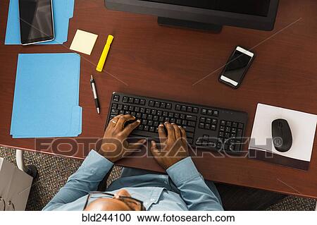 African American man typing on computer keyboard in office View Large Photo Image Stock Image - African American man typing on computer keyboard in office. Fotosearch
