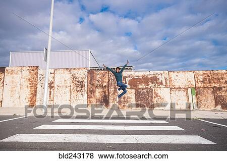 African American woman jumping for joy in crosswalk View Large Photo Image Stock Photo - African American woman jumping for joy in crosswalk. Fotosearch