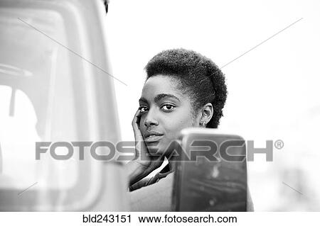 African American woman leaning on car View Large Photo Image Stock Image - African American woman leaning on car. Fotosearch