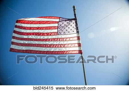 American Flag blowing in wind View Large Photo Image Stock Photography - American Flag blowing in wind. Fotosearch