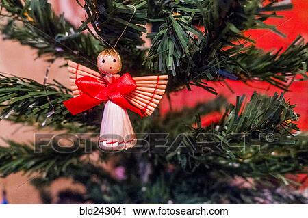 Stock Image - Angel ornament on Christmas tree. Fotosearch
