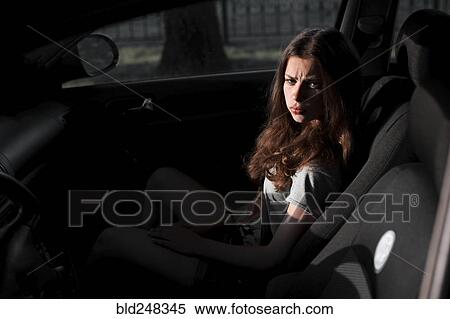 Angry Caucasian woman sitting in car at night View Large Photo Image Stock Photography - Angry Caucasian woman sitting in car at night. Fotosearch