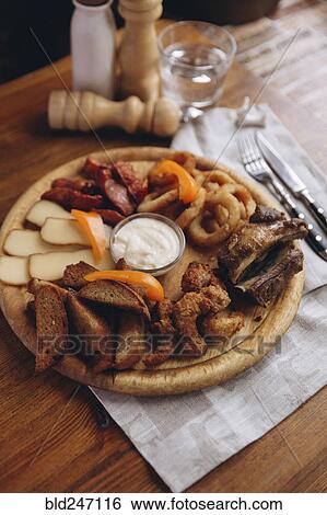 Appetizers with sauce on table View Large Photo Image Stock Photograph - Appetizers with sauce on table. Fotosearch