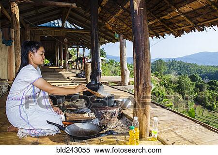 Asian woman cooking on patio outdoors View Large Photo Image Stock Photography - Asian woman cooking on patio outdoors. Fotosearch