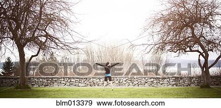 Asian woman exercising in park View Large Photo Image Stock Photo - Asian woman exercising in park. Fotosearch