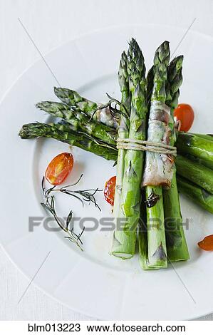 Stock Image - Asparagus on plate. Fotosearch