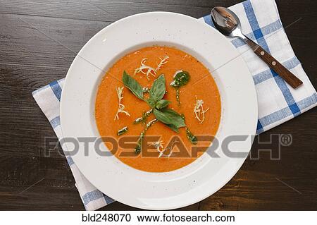 Basil in bowl of tomato soup View Large Photo Image Stock Image - Basil in bowl of tomato soup. Fotosearch