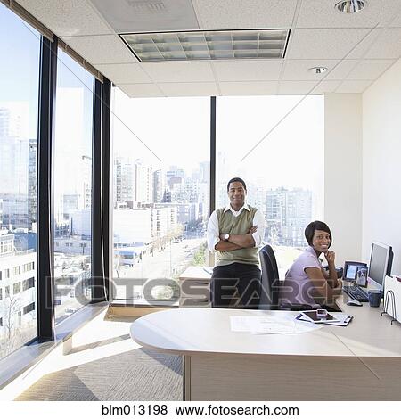 Stock Photo - Black business people in office. Fotosearch