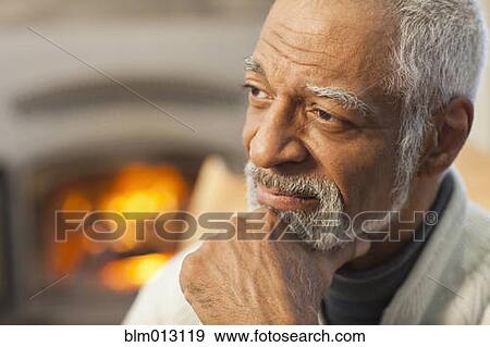 Black man with hand on chin View Large Photo Image Stock Photo - Black man with hand on chin. Fotosearch