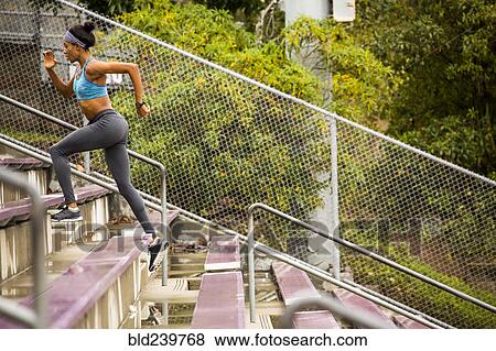 Black woman running on bleachers View Large Photo Image Stock Photo - Black woman running on bleachers. Fotosearch