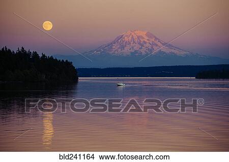 Boat in river near mountain under full moon View Large Photo Image Picture - Boat in river near mountain under full moon. Fotosearch