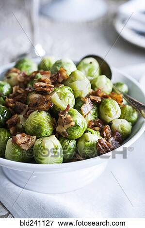 Bowl of brussels sprouts with bacon View Large Photo Image Stock Photo - Bowl of brussels sprouts with bacon. Fotosearch