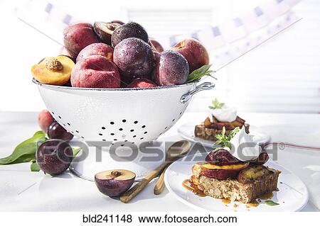 Bowl of fresh fruit in colander with dessert cake View Large Photo Image Stock Photo - Bowl of fresh fruit in colander with dessert cake. Fotosearch