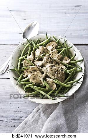Stock Image - Bowl of green beans and mushrooms. Fotosearch