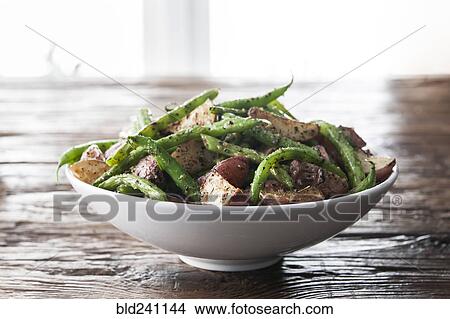 Bowl of green beans and roasted potatoes View Large Photo Image Picture - Bowl of green beans and roasted potatoes. Fotosearch