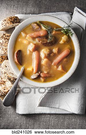 Bowl of stew with bread and napkin View Large Photo Image Stock Photograph - Bowl of stew with bread and napkin. Fotosearch