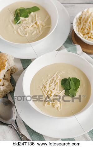 Bowls of cheese soup on table View Large Photo Image Stock Photograph - Bowls of cheese soup on table. Fotosearch