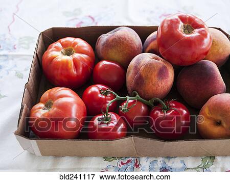 Box of fresh tomatoes and peaches View Large Photo Image Stock Photo - Box of fresh tomatoes and peaches. Fotosearch