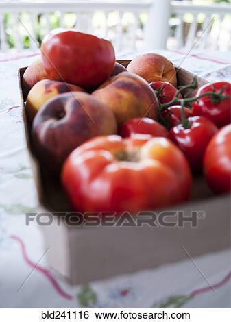 Box of fresh tomatoes and peaches View Large Photo Image Stock Photograph - Box of fresh tomatoes and peaches. Fotosearch