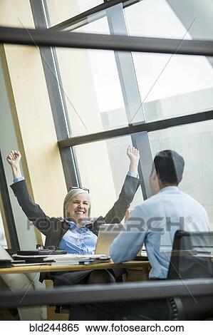 Business people celebrating in meeting View Large Photo Image Stock Photography - Business people celebrating in meeting. Fotosearch