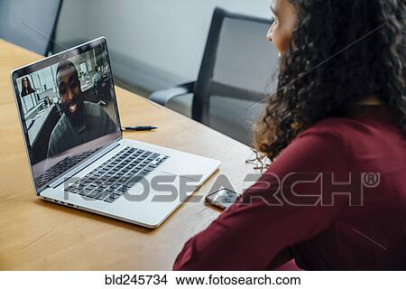 Picture - Business people on video conference. Fotosearch