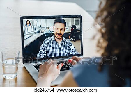 Business people on video conference View Large Photo Image Picture - Business people on video conference. Fotosearch