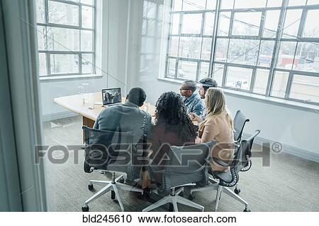 Business people on video conference View Large Photo Image Stock Image - Business people on video conference. Fotosearch