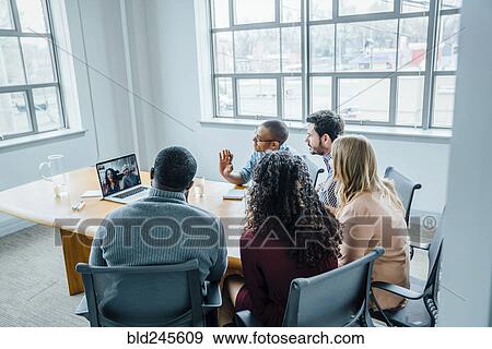 Business people on video conference View Large Photo Image Stock Photo - Business people on video conference. Fotosearch