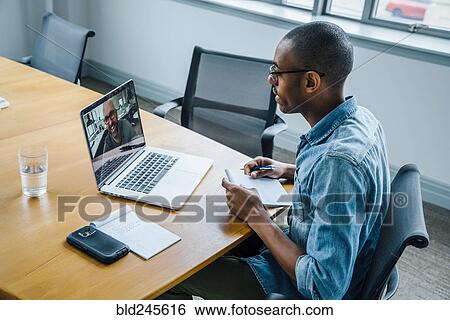 Stock Photograph - Business people on video conference. Fotosearch