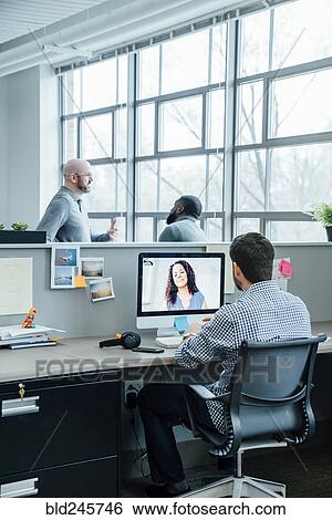 Business people on video conference View Large Photo Image Stock Photograph - Business people on video conference. Fotosearch