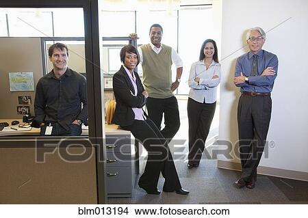 Picture - Business people standing together in office. Fotosearch