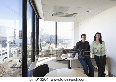Picture - Business people standing together in office. Fotosearch