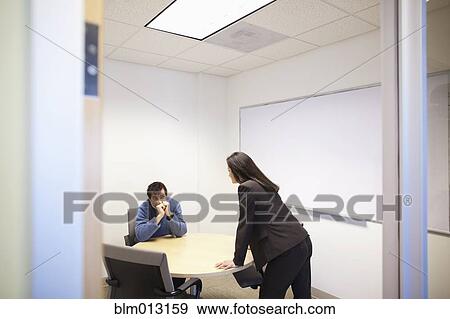 Business people talking in conference room View Large Photo Image Stock Photo - Business people talking in conference room. Fotosearch