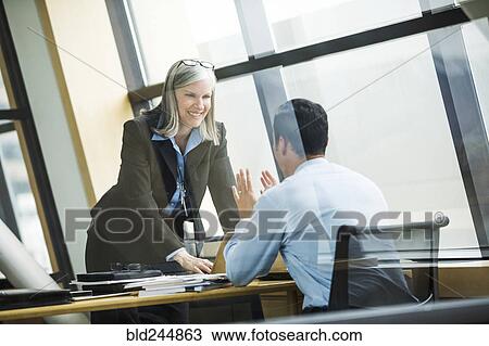 Business people talking in meeting View Large Photo Image Stock Image - Business people talking in meeting. Fotosearch