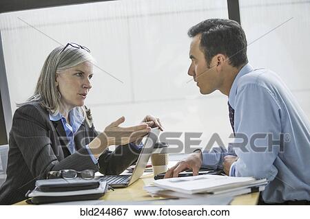 Stock Photo - Business people talking in meeting. Fotosearch