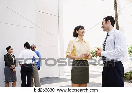 Business people talking outdoors View Large Photo Image Stock Image - Business people talking outdoors. Fotosearch