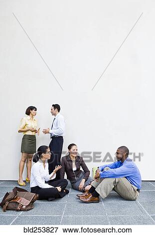 Business people talking outdoors View Large Photo Image Stock Photo - Business people talking outdoors. Fotosearch