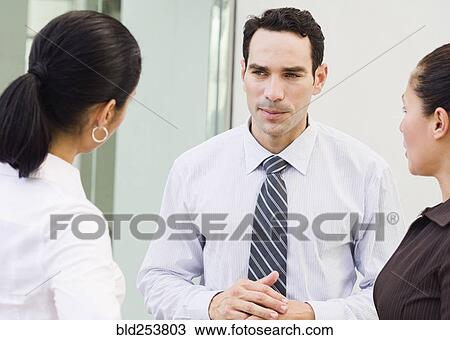 Business people talking View Large Photo Image Stock Image - Business people talking. Fotosearch