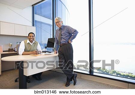 Stock Photograph - Business people together in office. Fotosearch