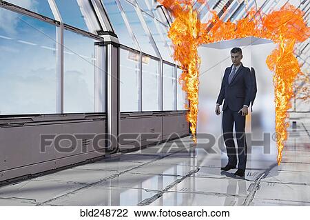 Stock Image - Businessman burning in suspended animation. Fotosearch